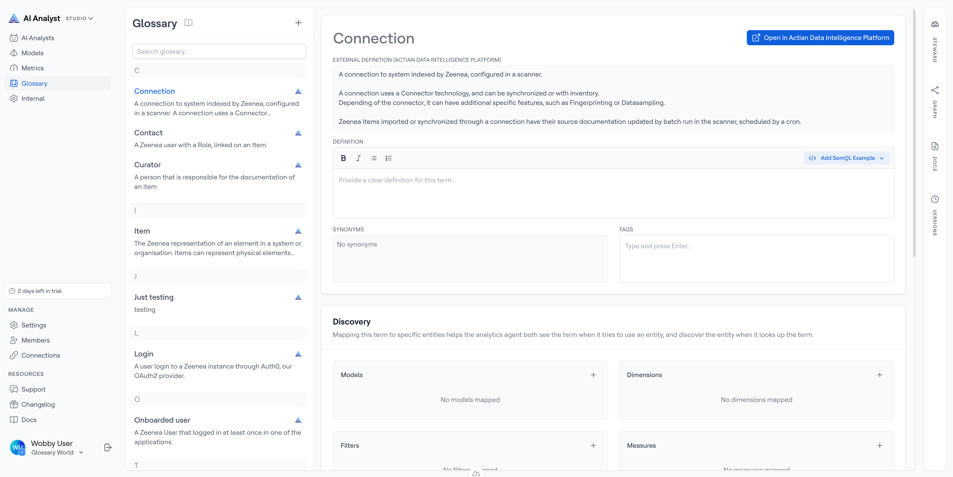 Glossary page showing a synced term with its source badge next to a manually created term